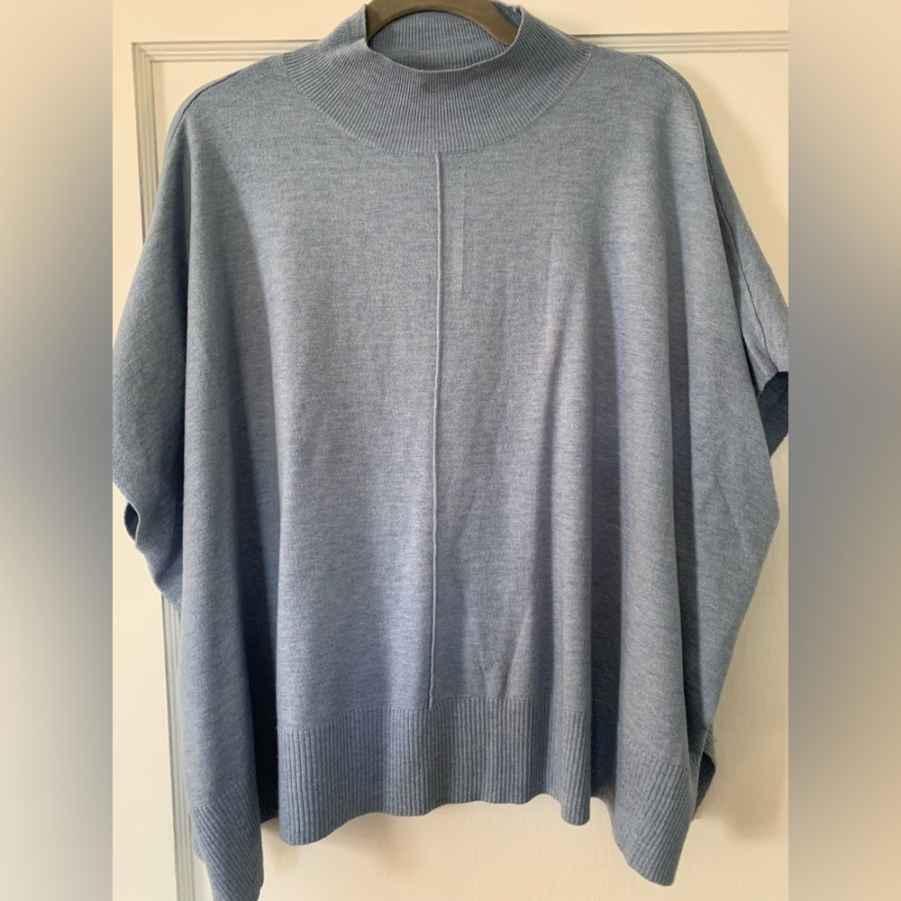Kerisma Aja blue shorter top in one size. NWOT